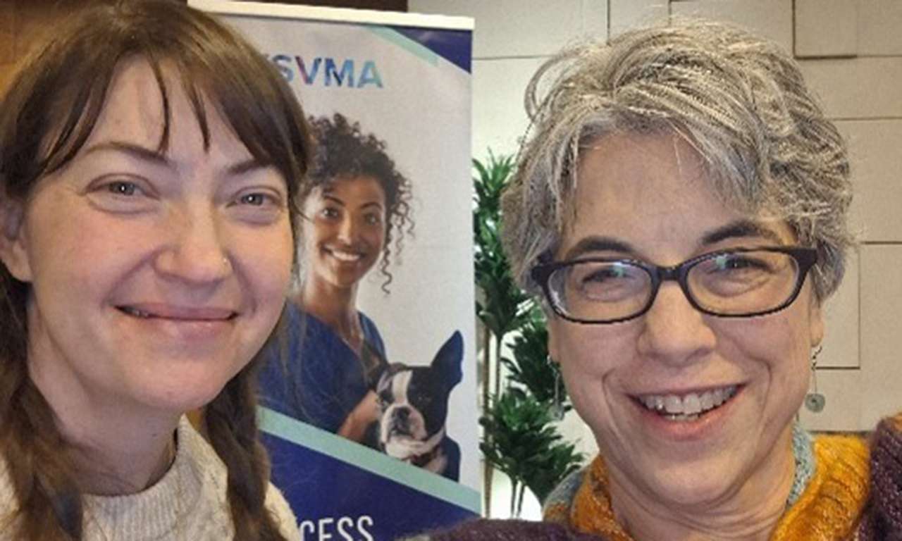 Close up of Dr. Sperlich and vet tech, Tovah a the vet dental conference.